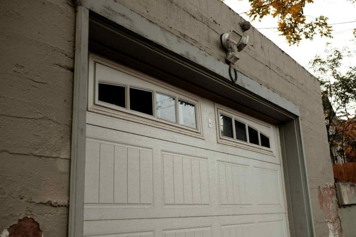 Professional technician installing a new garage door