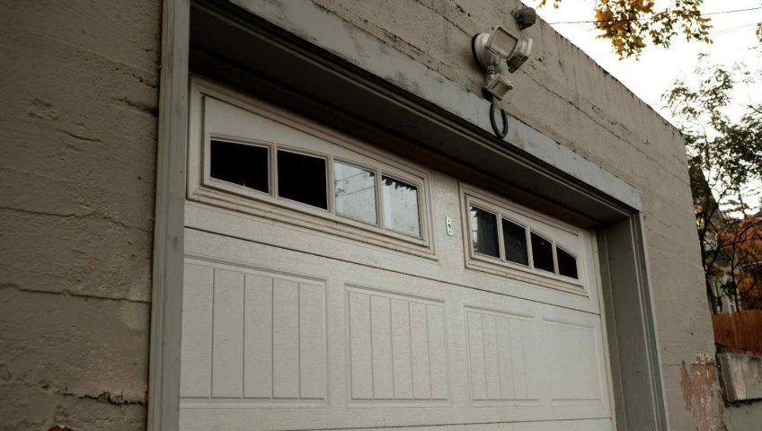 Professional technician installing a new garage door